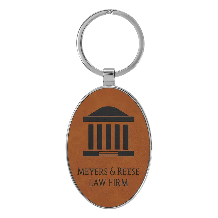 Rawhide Lasered Leatherette/Metal Oval Keychain